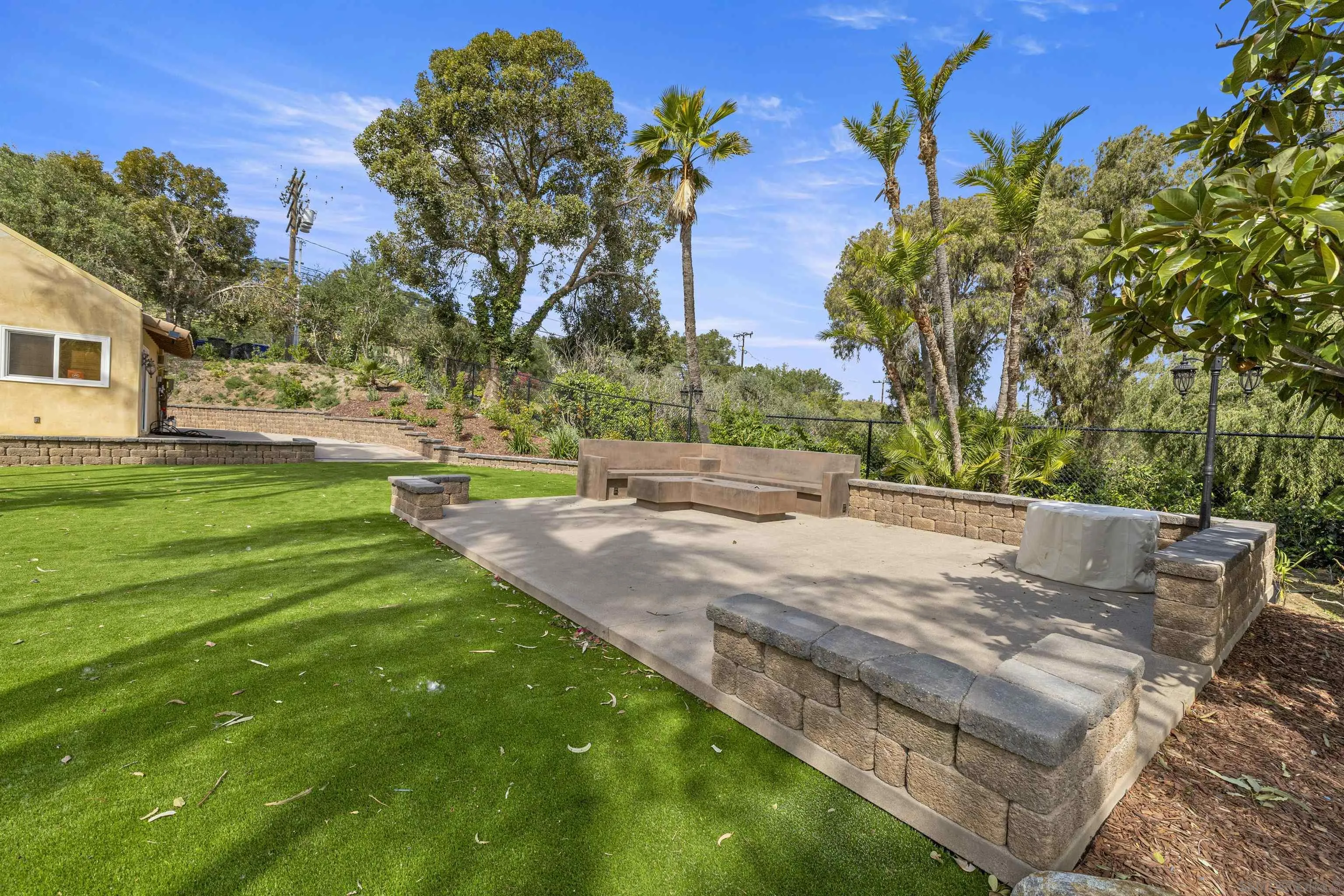 1315 Macadamia Drive Fallbrook, CA 92028 - Photo 48 of 59 a view of a yard with a house