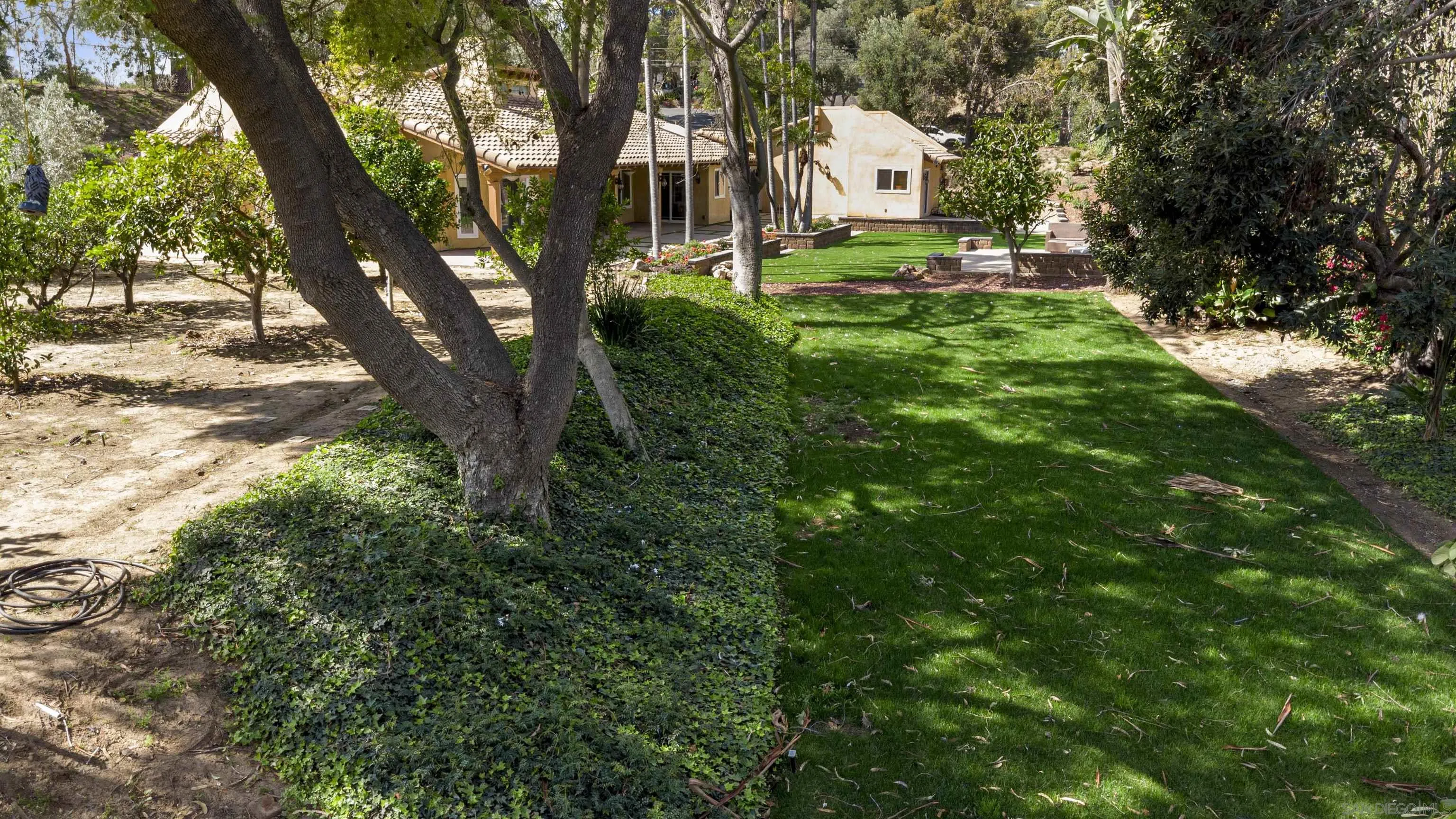 1315 Macadamia Drive Fallbrook, CA 92028 - Photo 8 of 59 a view of a house with a yard