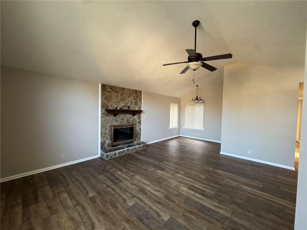 316 Ridgestone Drive Warner Robins, GA 31088 - Photo 12 of 21 a view of a livingroom with a fireplace a ceiling fan and wooden floor