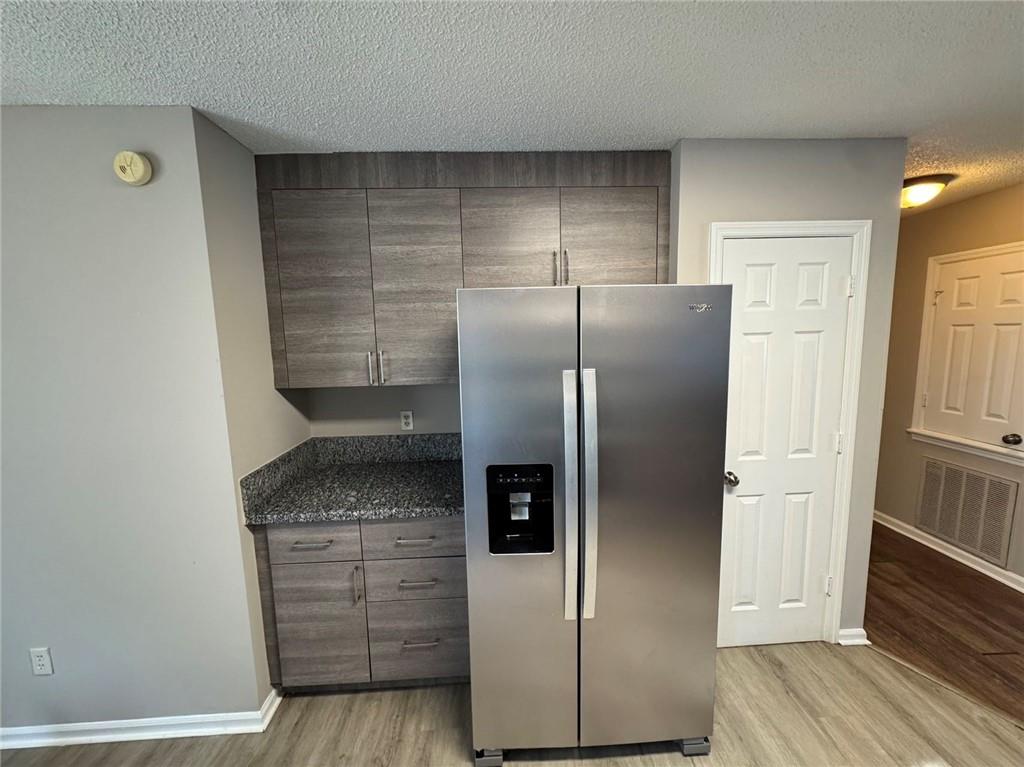 316 Ridgestone Drive Warner Robins, GA 31088 - Photo 18 of 21 a kitchen with stainless steel appliances granite countertop a refrigerator and a stove
