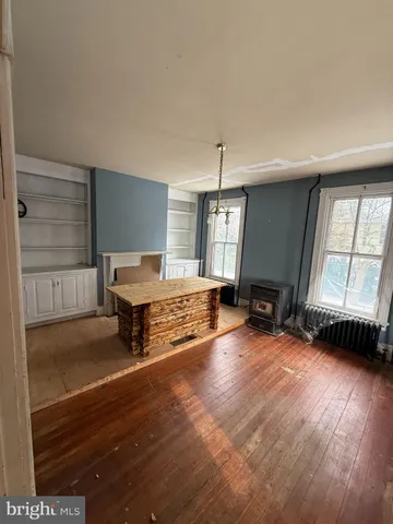 a view of livingroom with window and hardwood floor