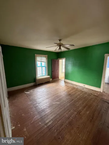 a view of a room with a window and a fireplace