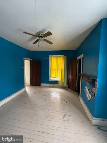 a view of a hallway and wooden floor