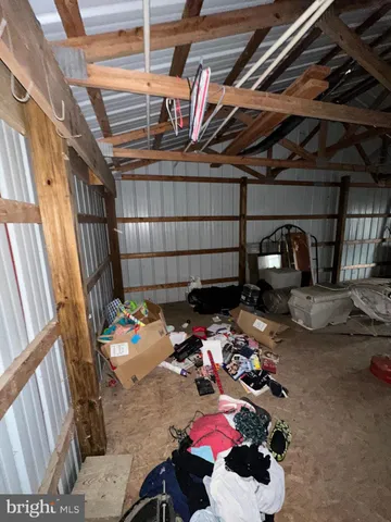 a view of empty room with wooden ceiling