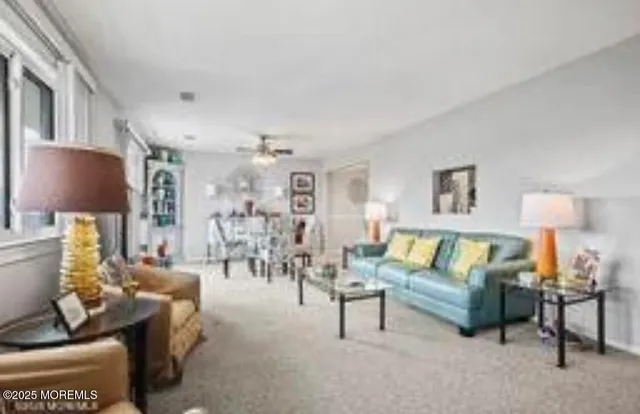 a living room with furniture and a lamp