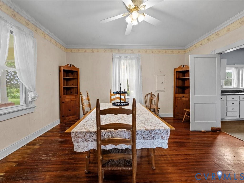 13330 Lodore Road Amelia Court House, VA 23002 - Photo 12 of 33 Dining space with crown molding, dark wood-style f