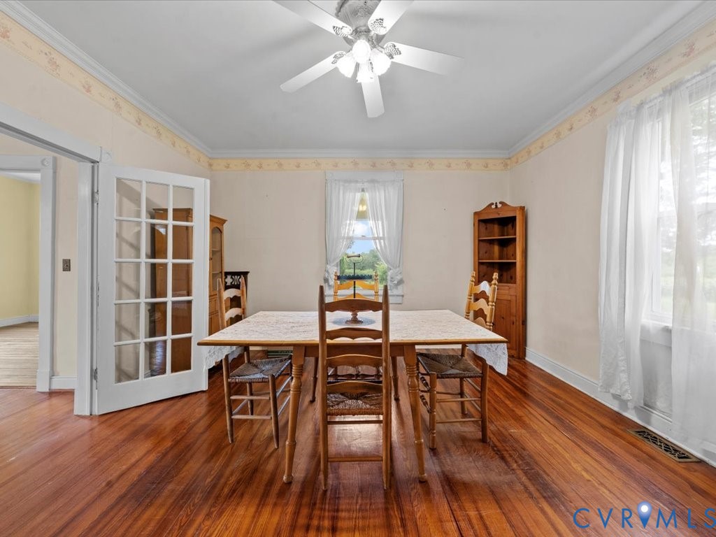 13330 Lodore Road Amelia Court House, VA 23002 - Photo 14 of 33 Dining space with crown molding, hardwood / wood-s