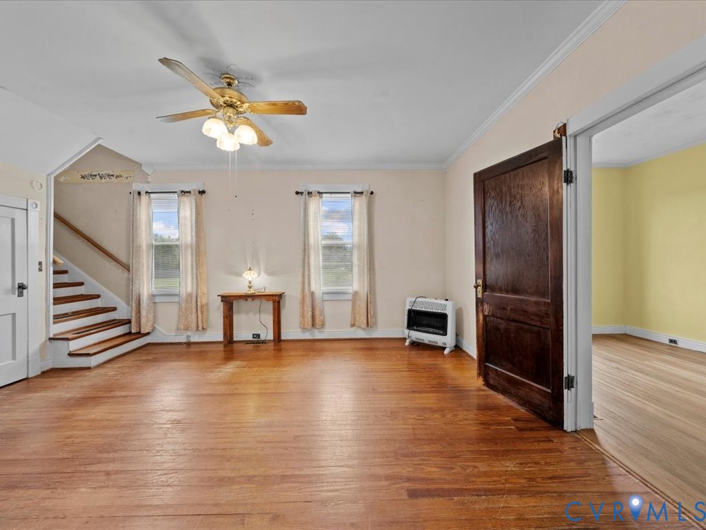 13330 Lodore Road Amelia Court House, VA 23002 - Photo 9 of 33 Unfurnished living room featuring crown molding, l