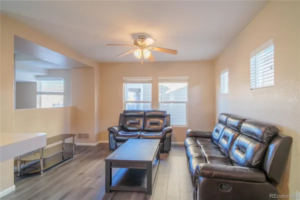 a living room with furniture and a window