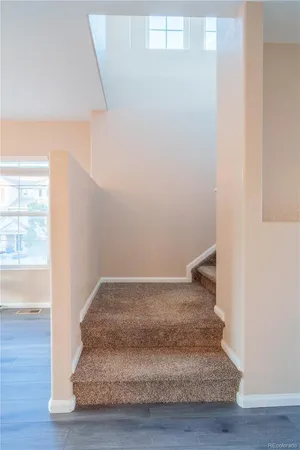 a view of entryway with wooden floor
