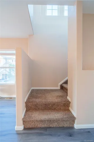 a view of entryway with wooden floor