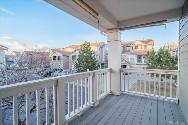 a view of a balcony with wooden floor