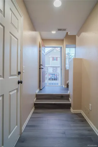 a view of entryway with wooden floor