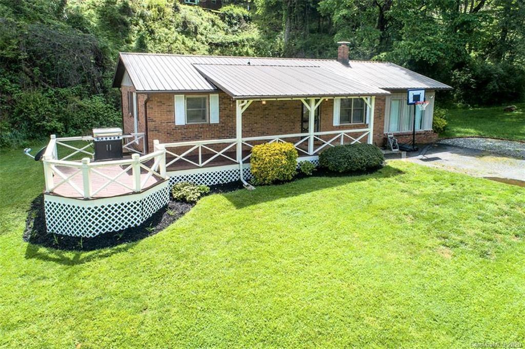 427 Kitchens Branch Road Sylva, NC 28779 - Photo 1 of 27 a front view of a house with a garden
