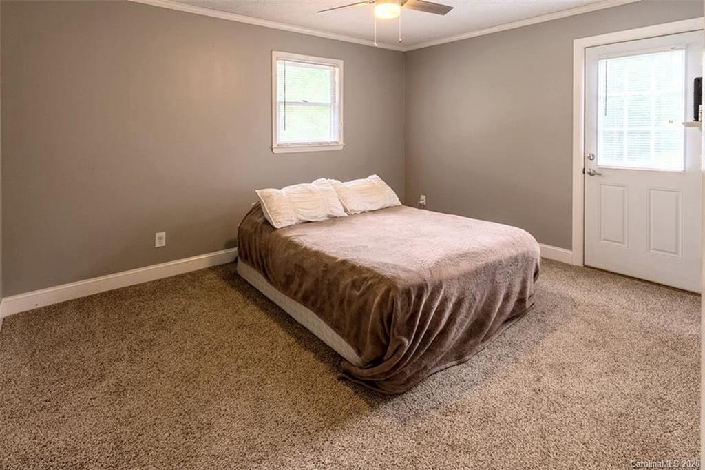 427 Kitchens Branch Road Sylva, NC 28779 - Photo 15 of 27 a bedroom with a bed and window