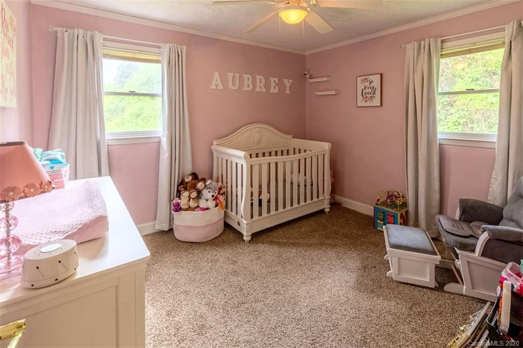 427 Kitchens Branch Road Sylva, NC 28779 - Photo 17 of 27 a bedroom with a bed and a window