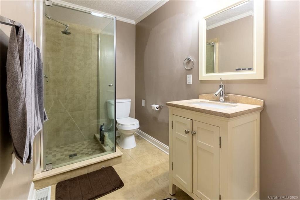 427 Kitchens Branch Road Sylva, NC 28779 - Photo 19 of 27 a bathroom with a sink and a mirror