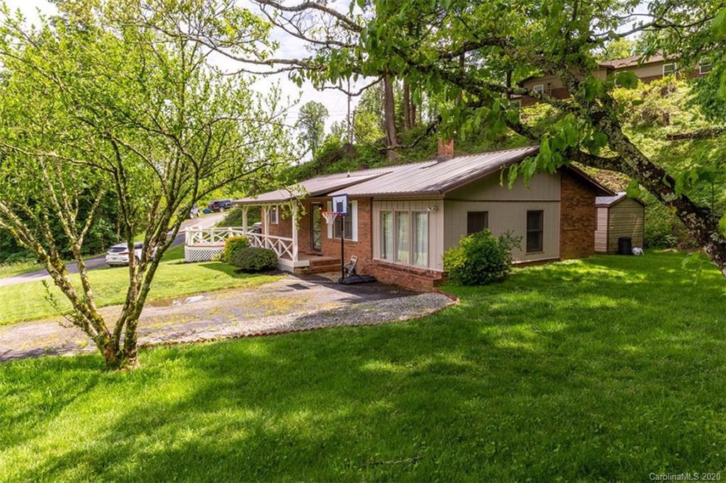 427 Kitchens Branch Road Sylva, NC 28779 - Photo 5 of 27 a view of house with a yard