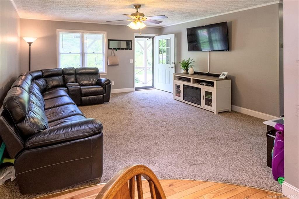427 Kitchens Branch Road Sylva, NC 28779 - Photo 10 of 27 a living room with furniture and a flat screen tv