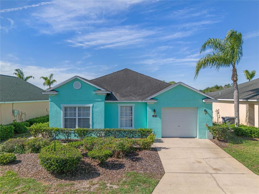 233 Reserve Drive Davenport, FL 33896 - Photo 1 of 25 a front view of house with yard and green space