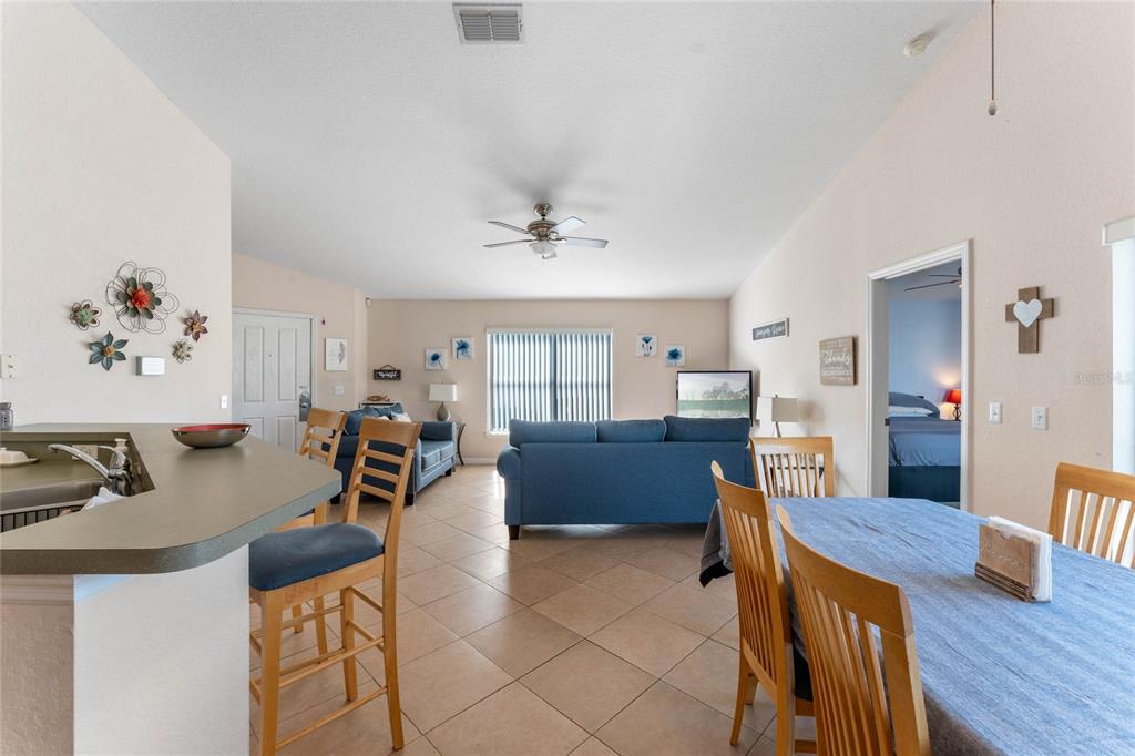 233 Reserve Drive Davenport, FL 33896 - Photo 11 of 25 a living room with furniture and a wooden floor