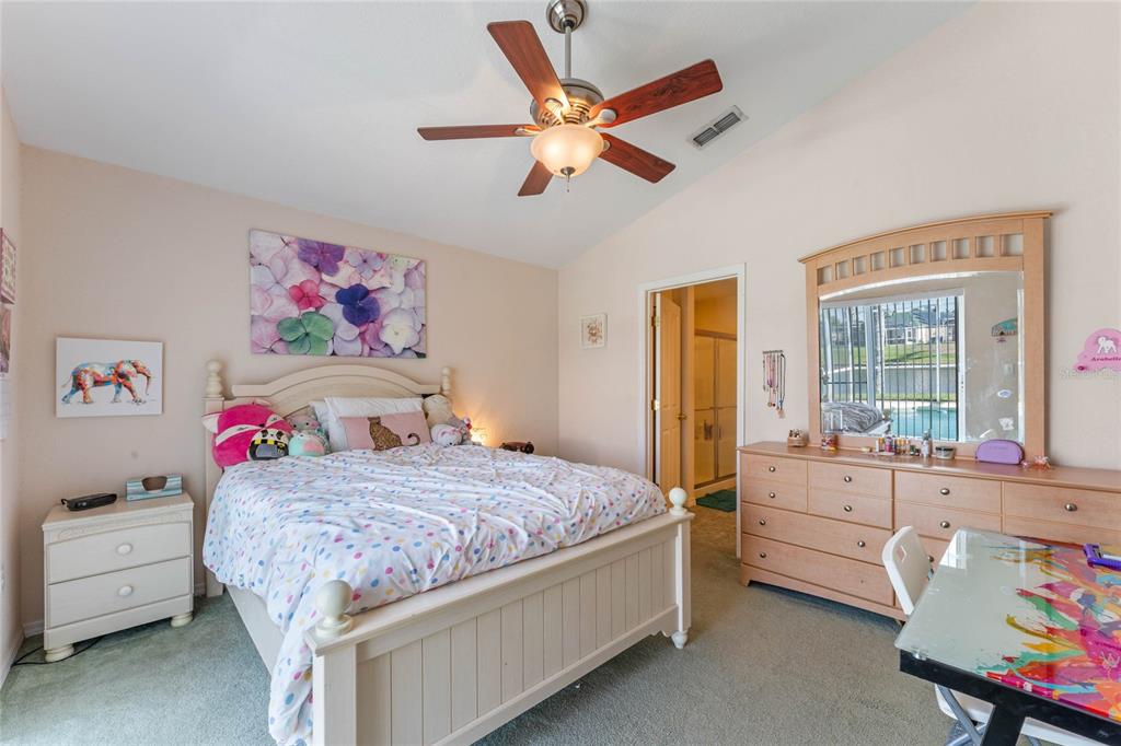 233 Reserve Drive Davenport, FL 33896 - Photo 17 of 25 a bedroom with a bed and a window