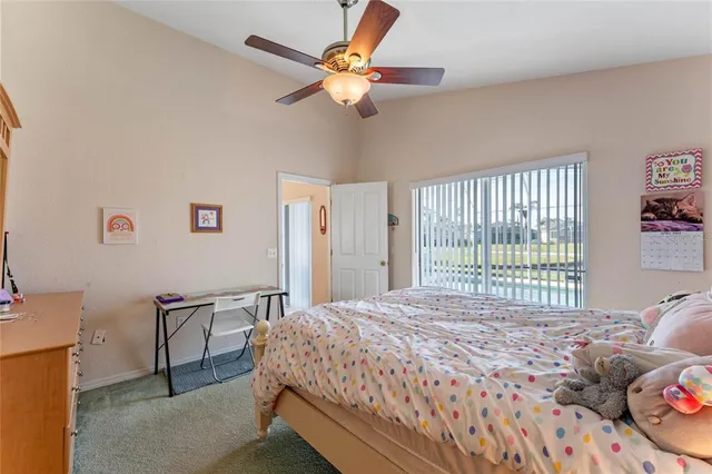 a bedroom with a bed dresser and a window