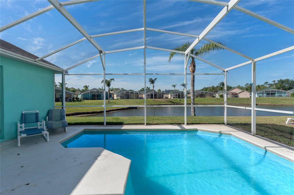 233 Reserve Drive Davenport, FL 33896 - Photo 4 of 25 a view of a room with wooden walls and stairs