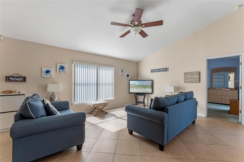 233 Reserve Drive Davenport, FL 33896 - Photo 6 of 25 a living room with furniture and a window