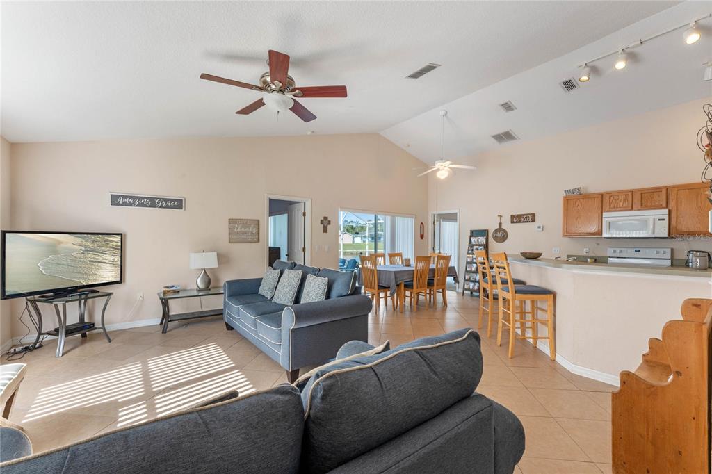 233 Reserve Drive Davenport, FL 33896 - Photo 7 of 25 a living room with furniture and kitchen view