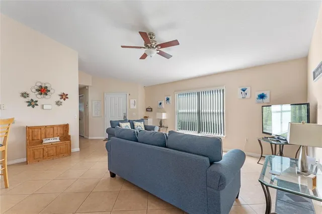 a living room with furniture and a window