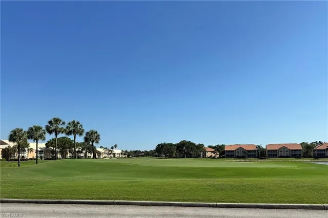 a view of a golf course with a lake