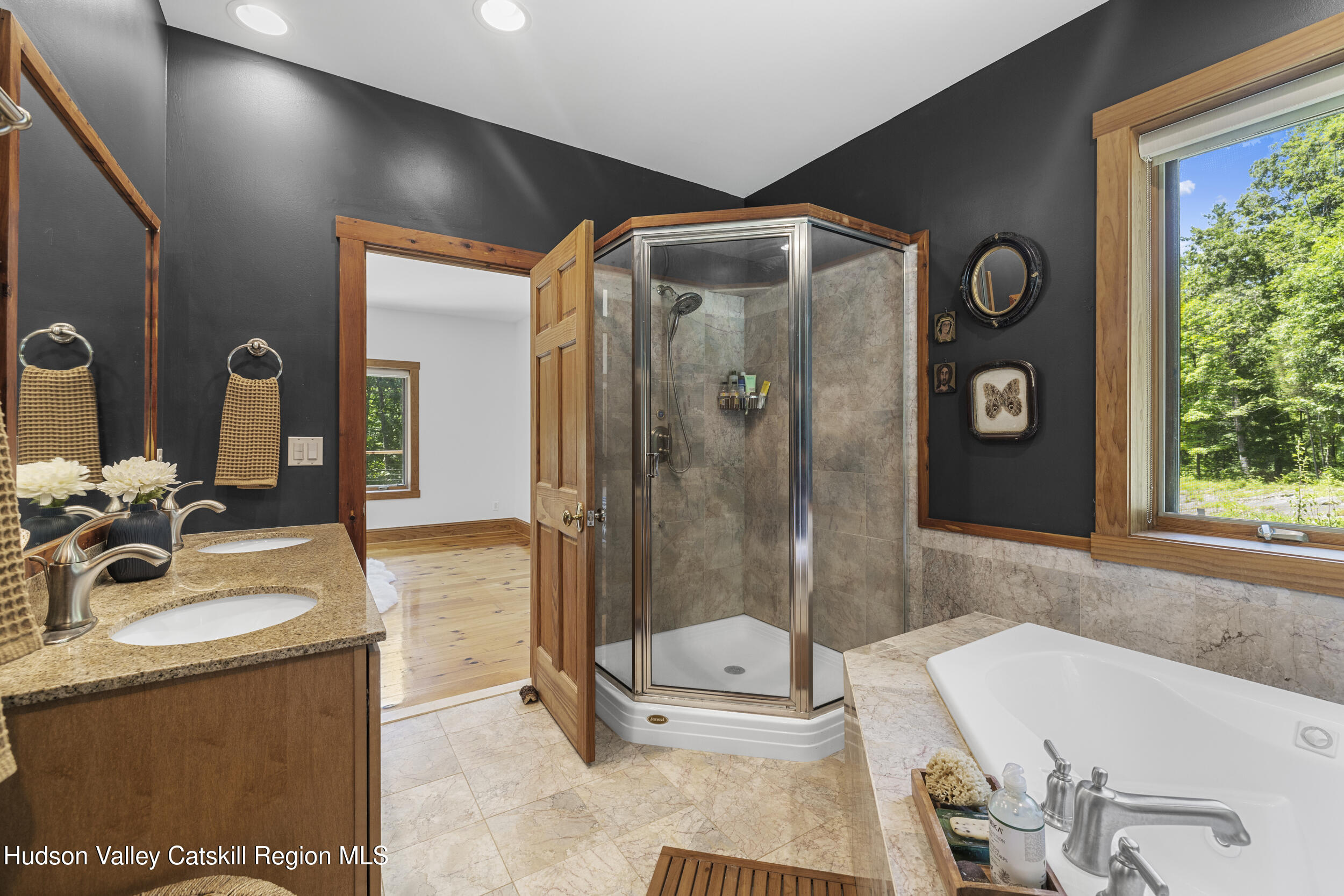 592 Swartekill Road Esopus, NY 12561 - Photo 13 of 38 a bathroom with a tub sink and mirror