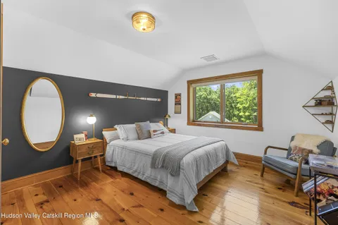 a view of a storage and utility room with washer and dryer