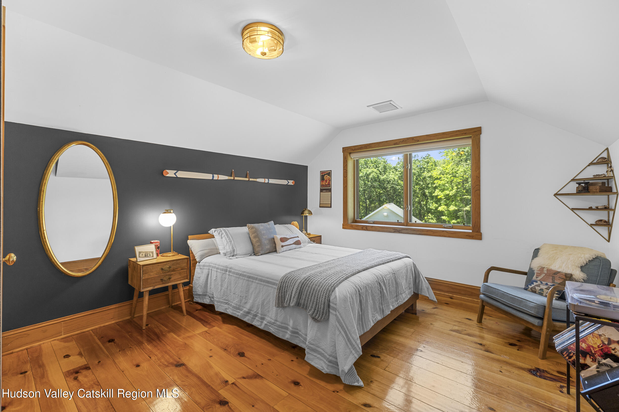 592 Swartekill Road Esopus, NY 12561 - Photo 16 of 38 a bedroom with a bed and a window