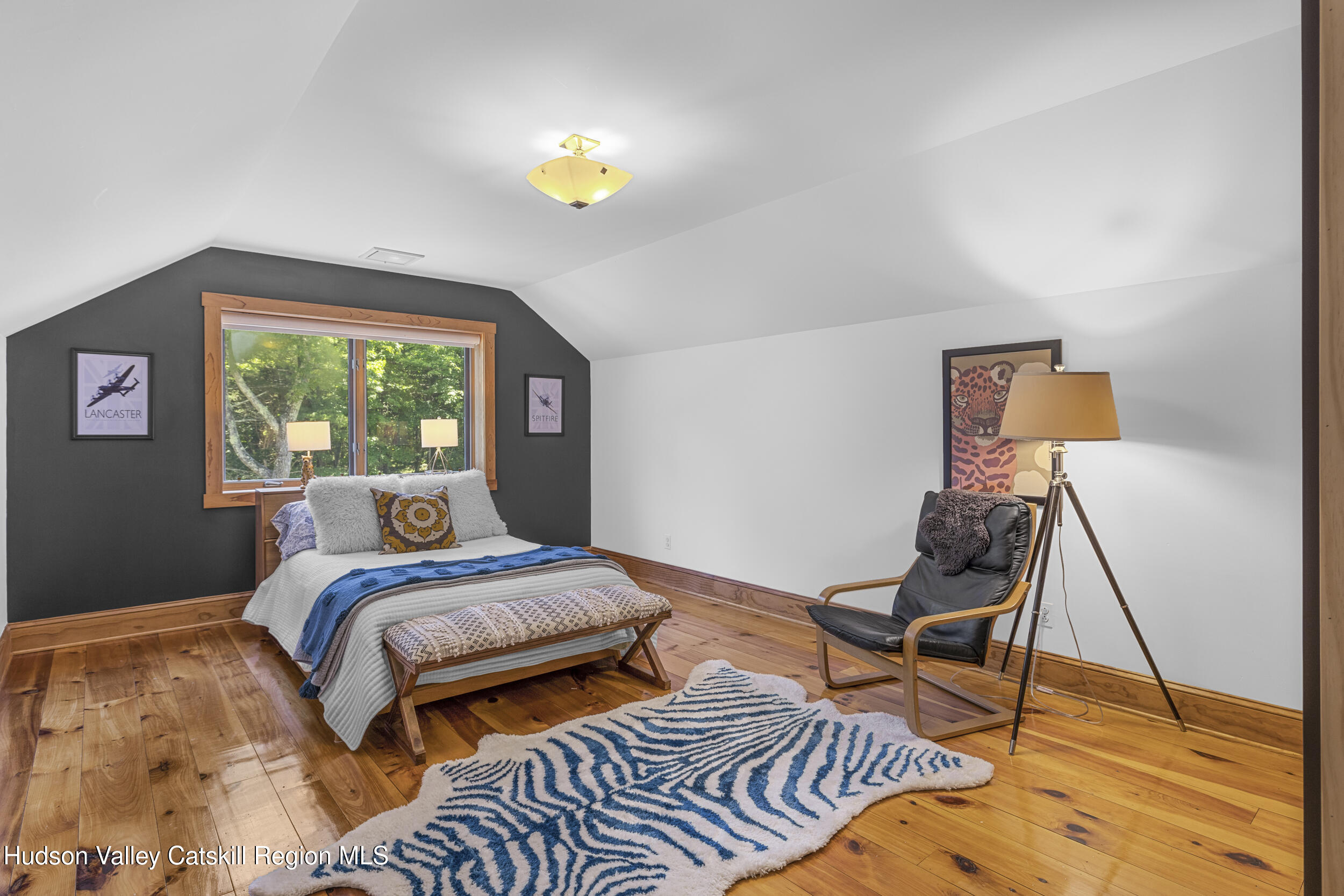 592 Swartekill Road Esopus, NY 12561 - Photo 17 of 38 a bedroom with a bed and wooden floor