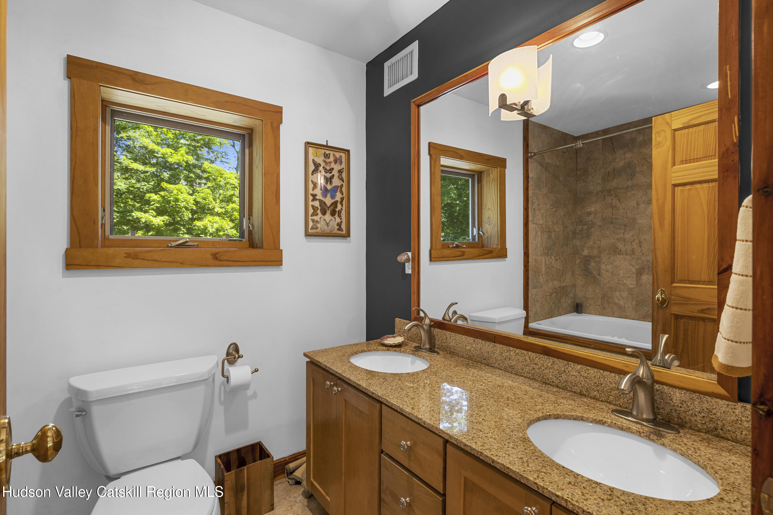 592 Swartekill Road Esopus, NY 12561 - Photo 20 of 38 a bathroom with a granite countertop sink mirror vanity and toilet