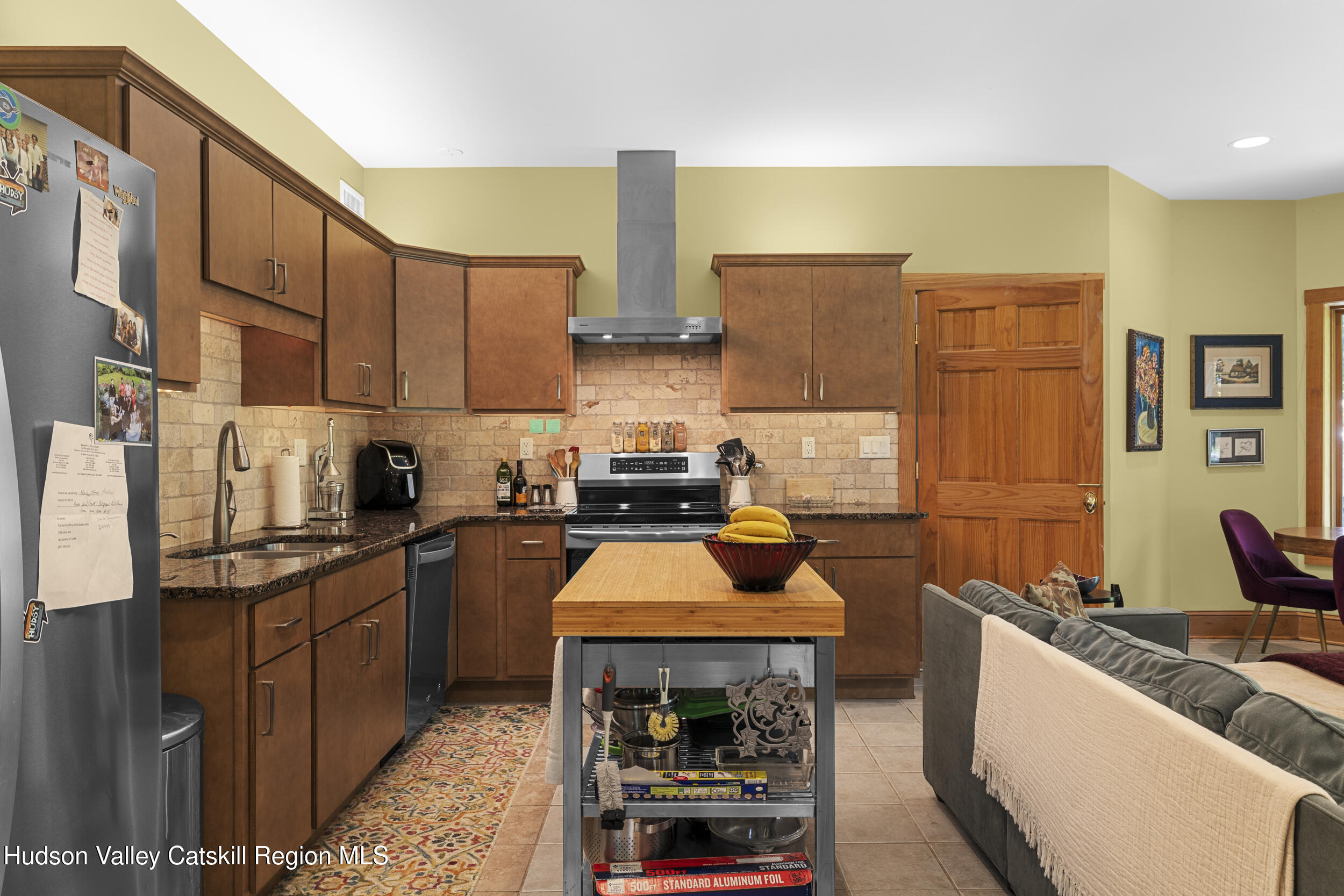 592 Swartekill Road Esopus, NY 12561 - Photo 27 of 38 a kitchen with stainless steel appliances granite countertop a stove a sink and a refrigerator