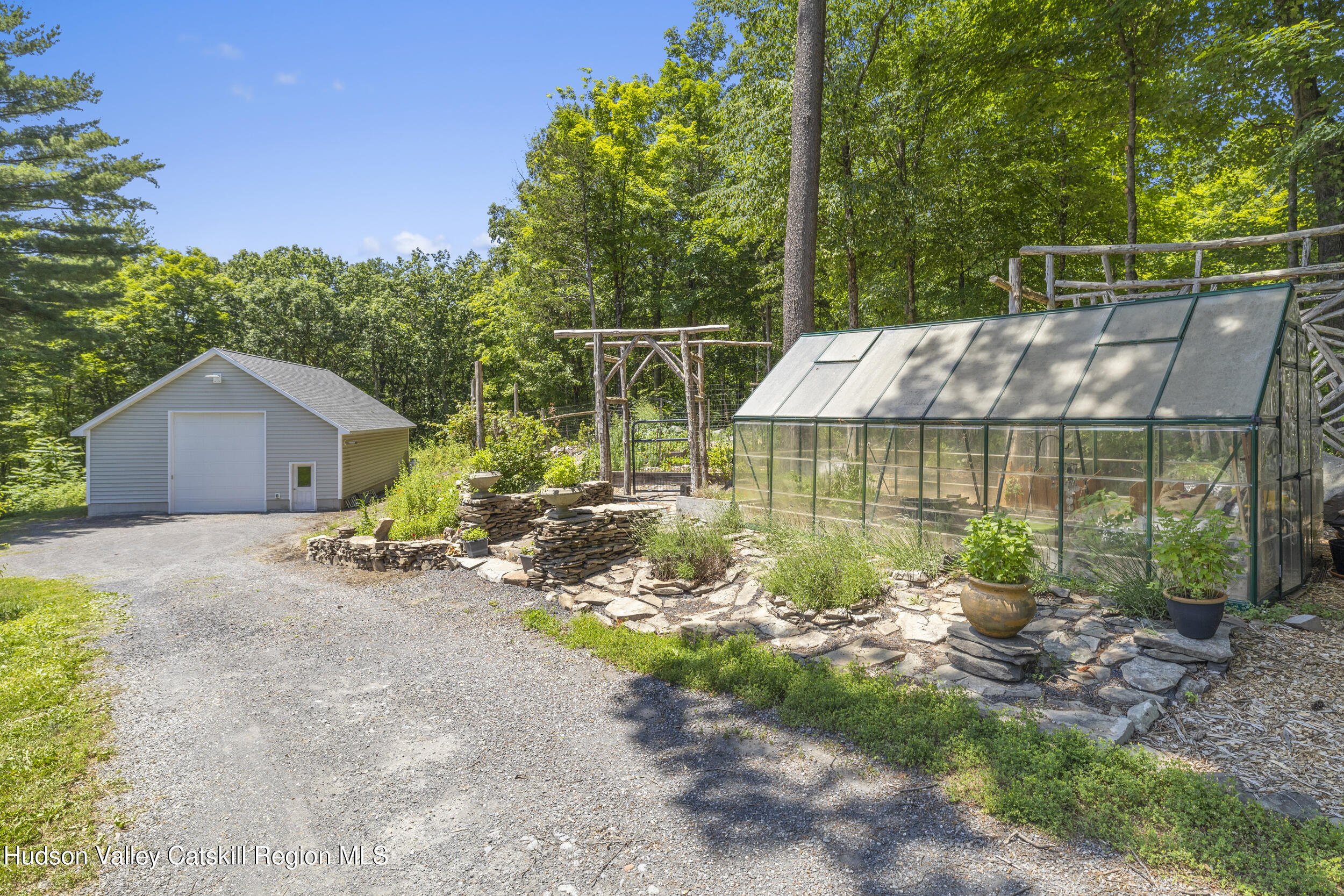 592 Swartekill Road Esopus, NY 12561 - Photo 28 of 38 a view of a house with backyard and sitting area