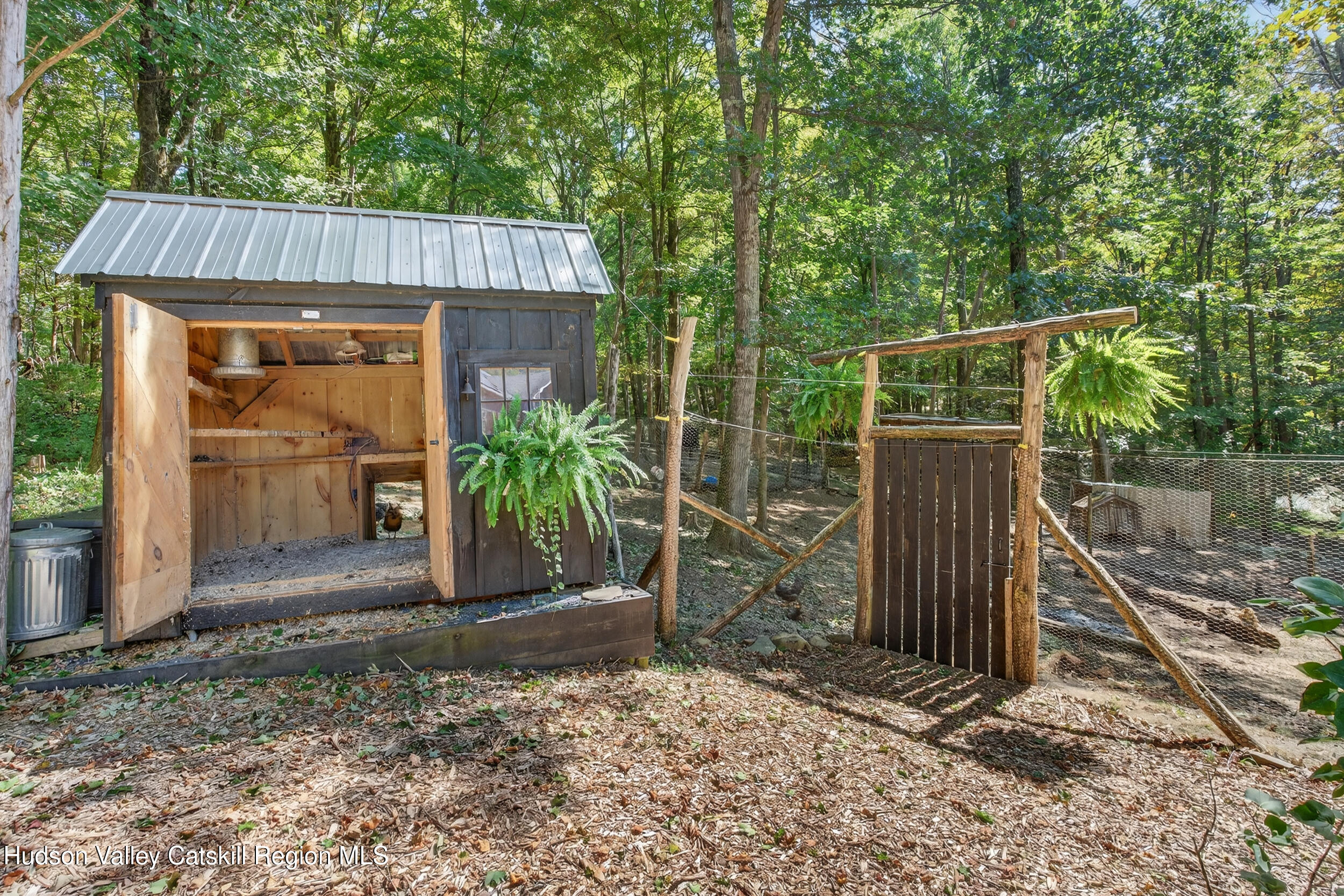 592 Swartekill Road Esopus, NY 12561 - Photo 33 of 38 a view of a house with a yard and wooden fence