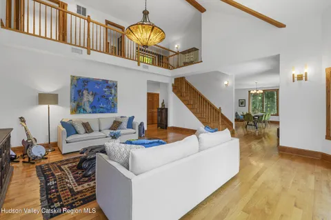 a living room with furniture or couch and a large window