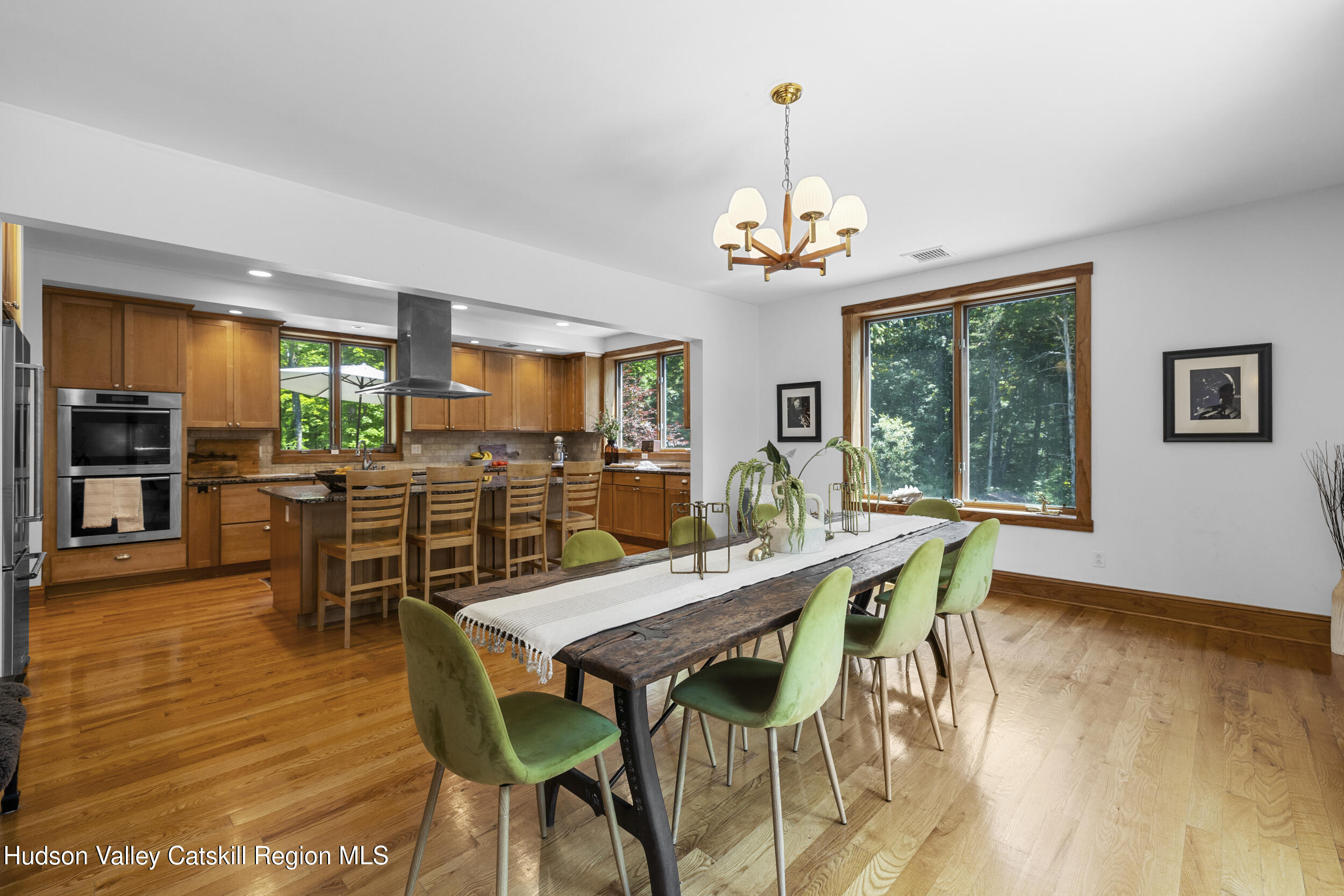 592 Swartekill Road Esopus, NY 12561 - Photo 7 of 38 a view of a dining room with furniture window and wooden floor