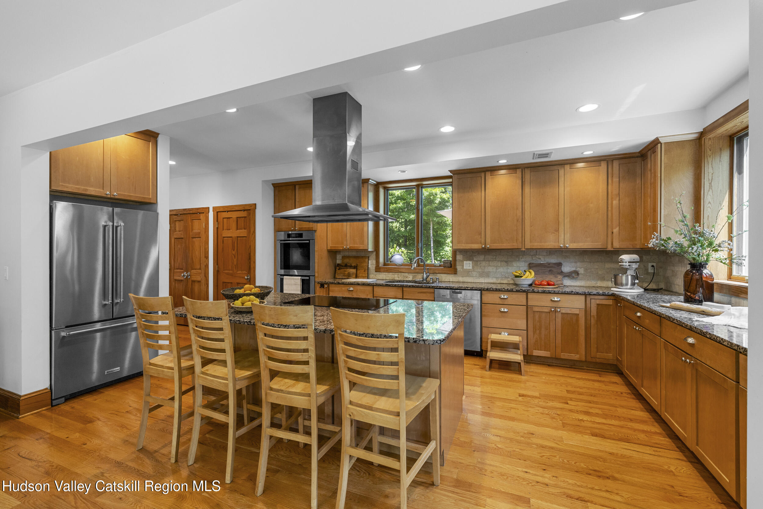 592 Swartekill Road Esopus, NY 12561 - Photo 9 of 38 a kitchen with stainless steel appliances kitchen island granite countertop a refrigerator and microwave