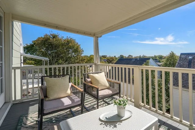 a view of a chairs and table on the deck