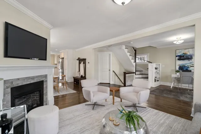 a living room with furniture fireplace and flat screen tv