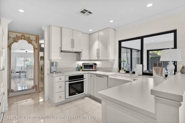 a kitchen with a sink stove and refrigerator