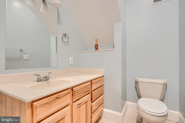 a bathroom with a shower sink and mirror