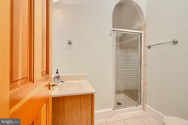 a bathroom with a sink and a shower