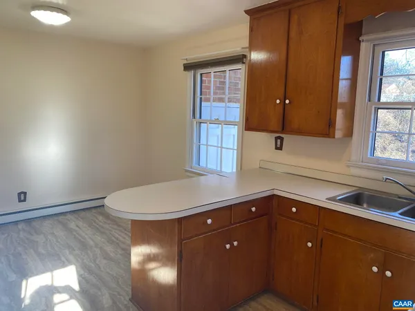 a kitchen with a sink and cabinets