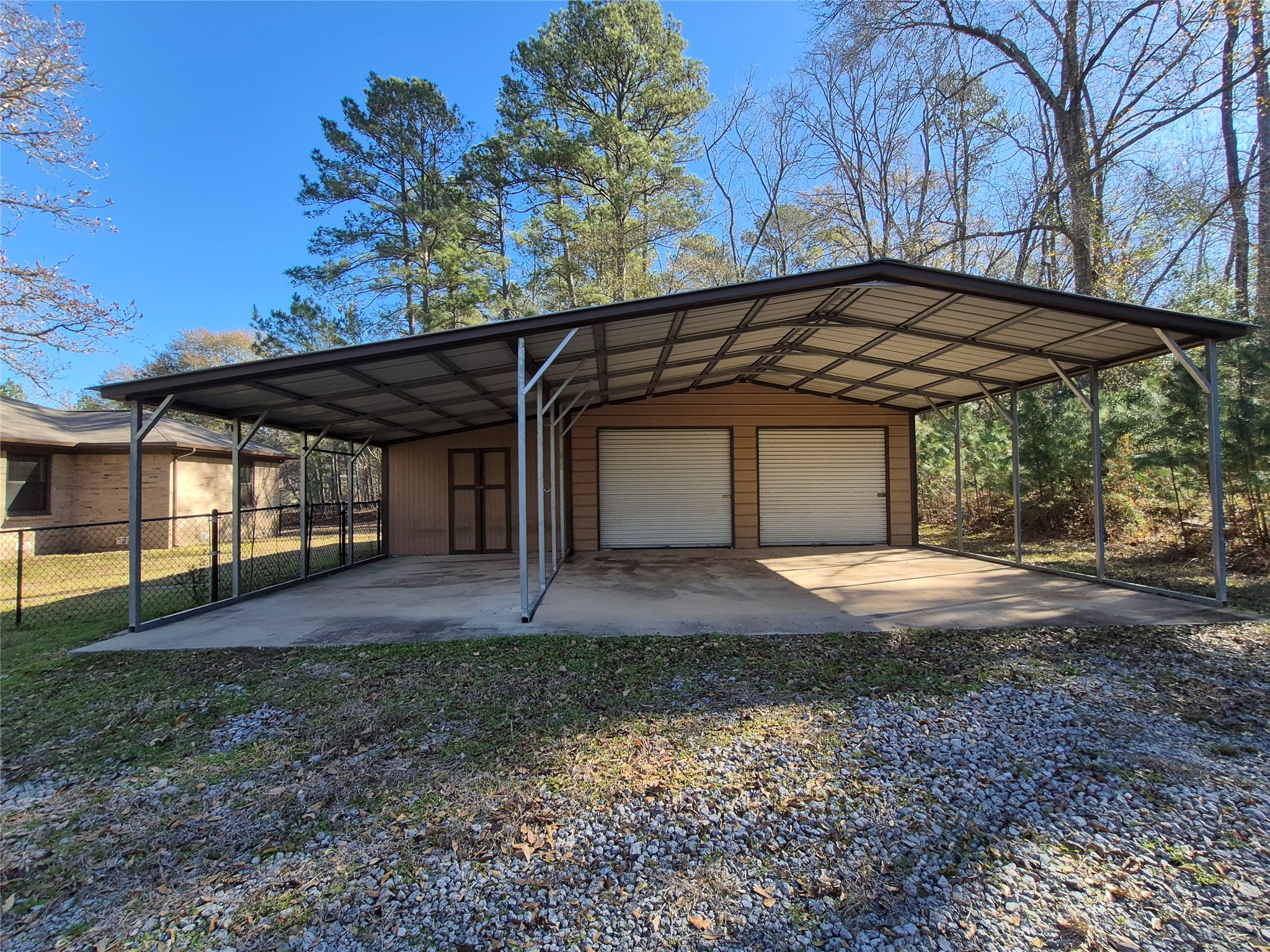 92 Summer Place Huntsville, TX 77340 - Photo 6 of 24 Detached garage/workshop and carport